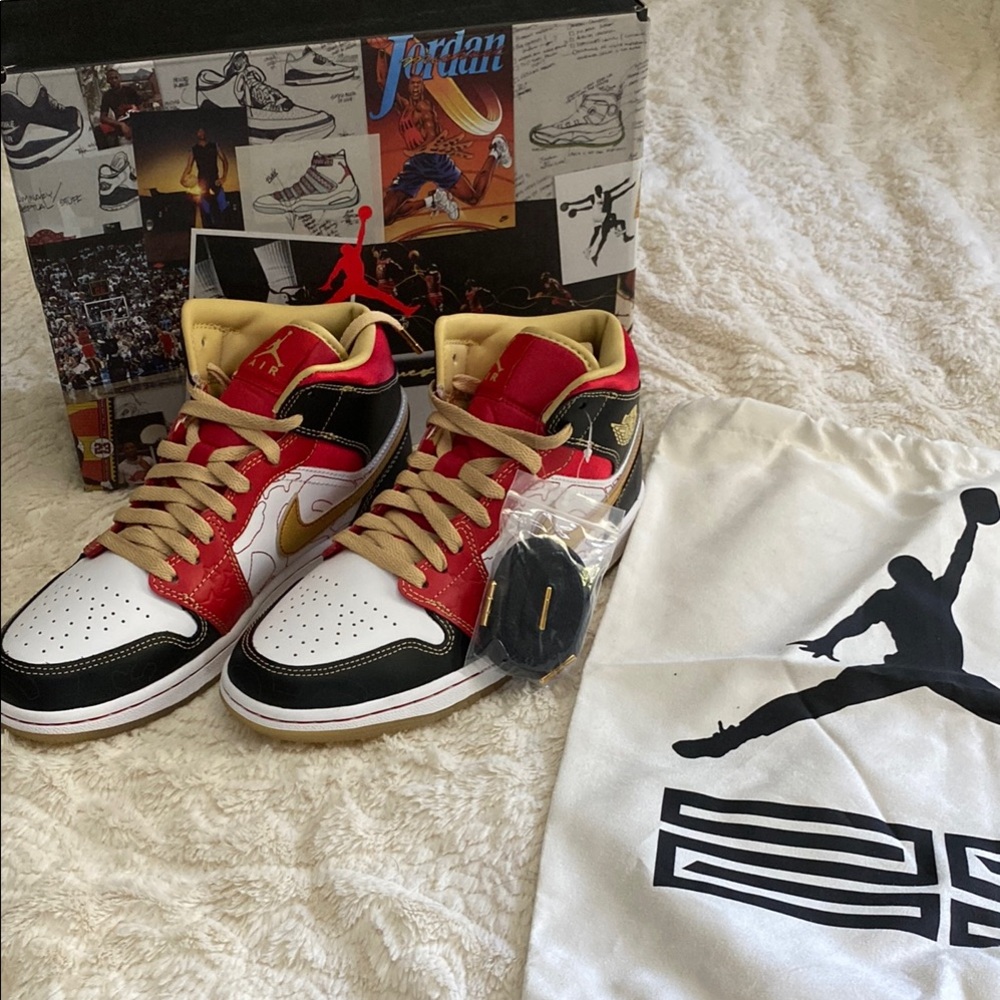 Red and Black Air Jordans with Gold Accents